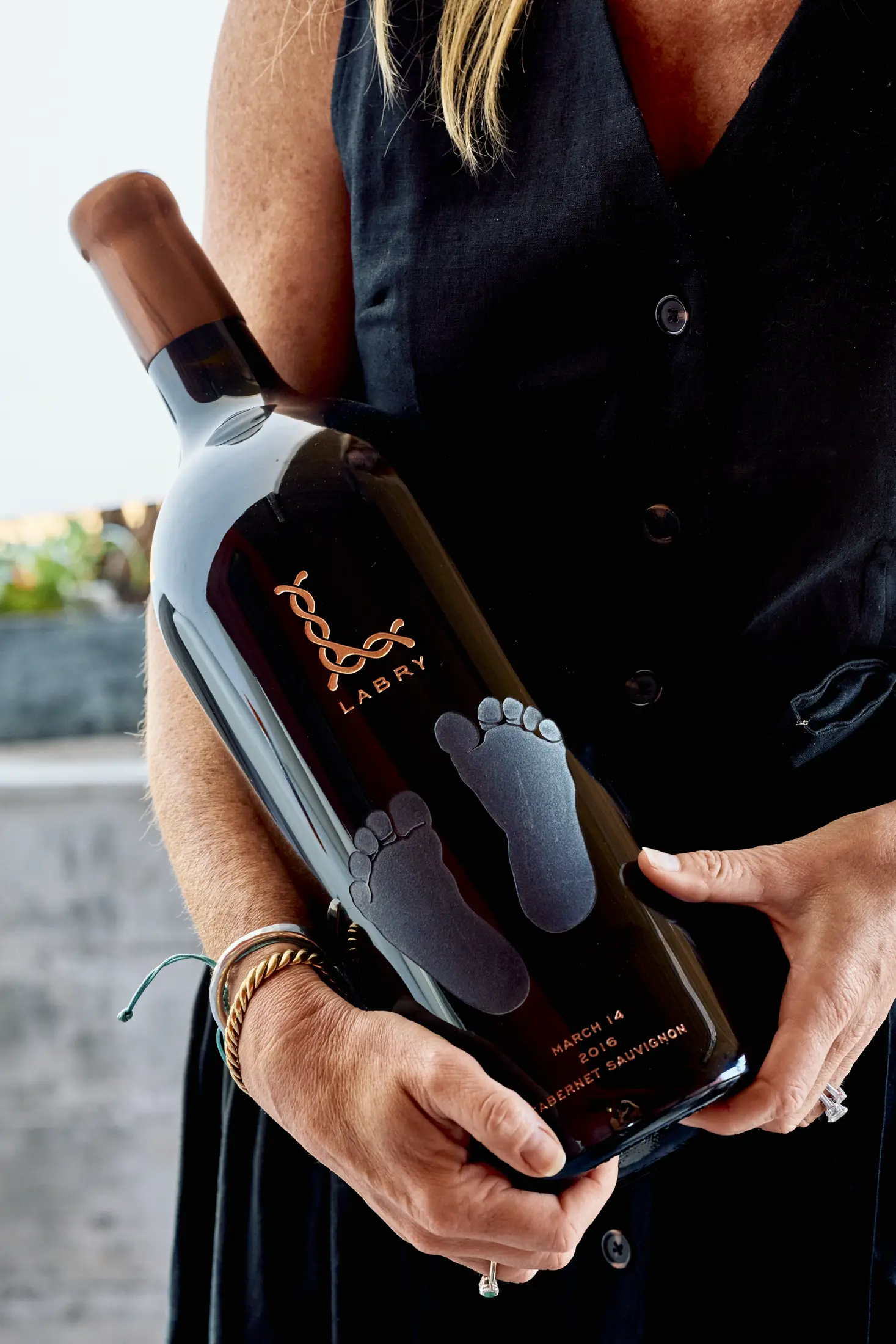Large Format 1 Woman holding a large format bottle of Labry wine